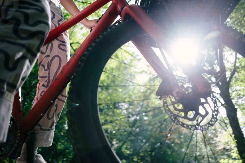 What is a non-suspension corrected bike and why is it better for bikepacking?