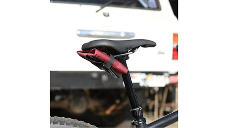 Bicycle seat with red padding on a blurred background