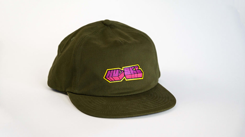 Hudski Bikes Green cap with a pink and yellow logo on a white background