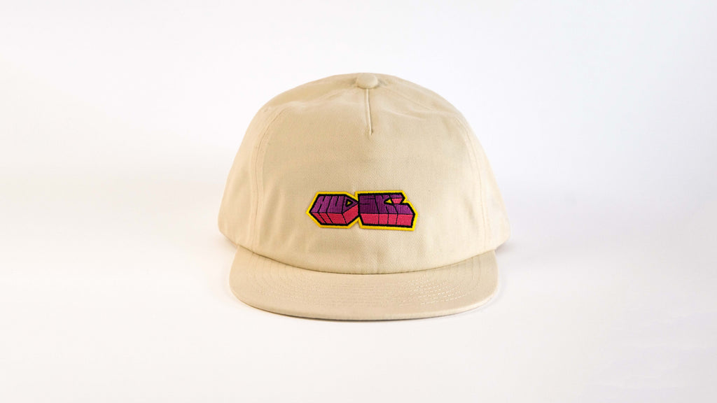 Hudski Bikes Beige cap with a colorful logo on a white background