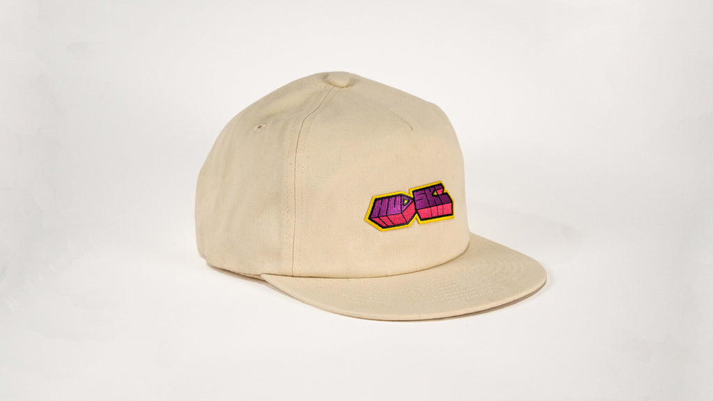 Hudski Bikes Beige cap with a colorful logo on a light gray background